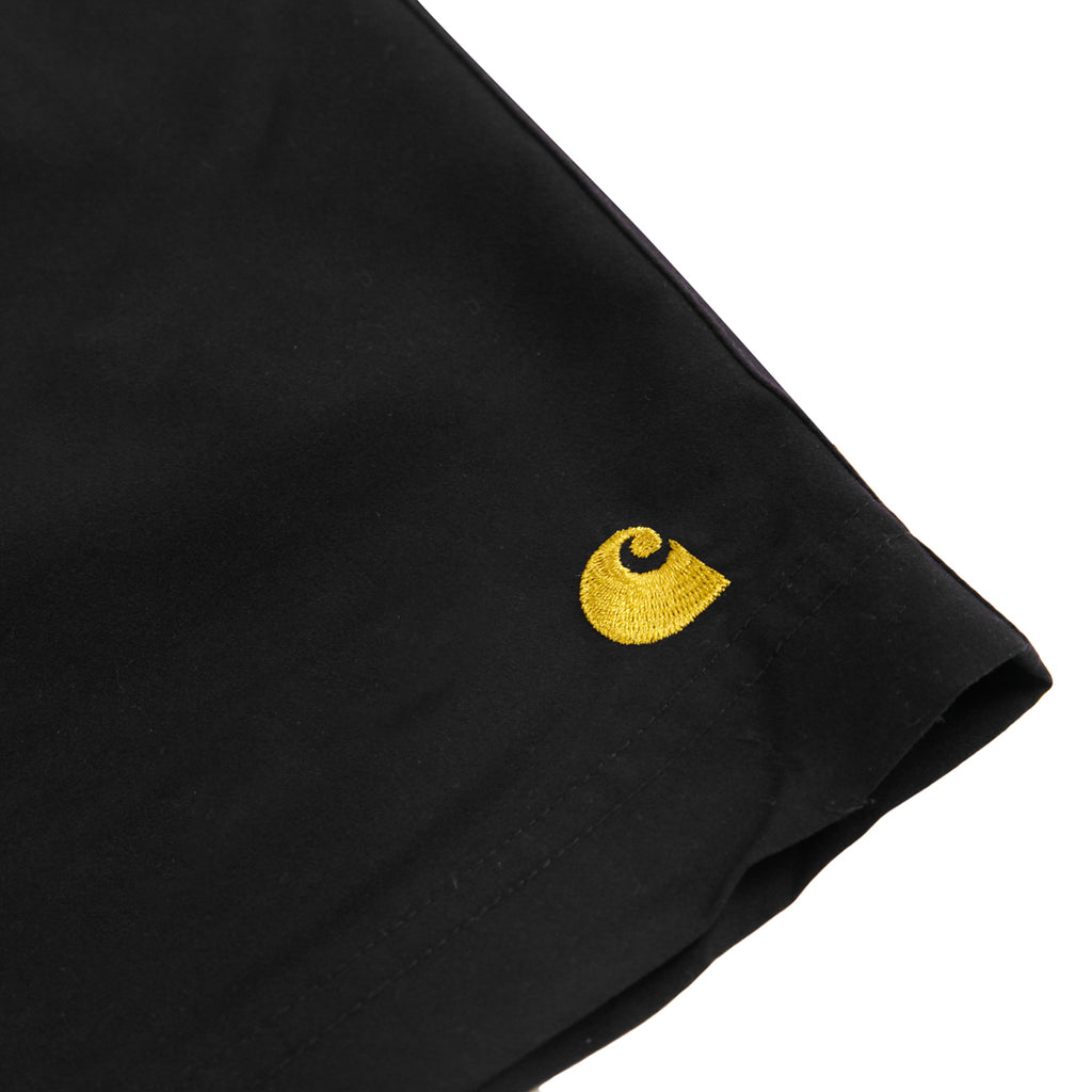 Carhartt WIP Chase Swim Shorts in Black / Gold - Leg